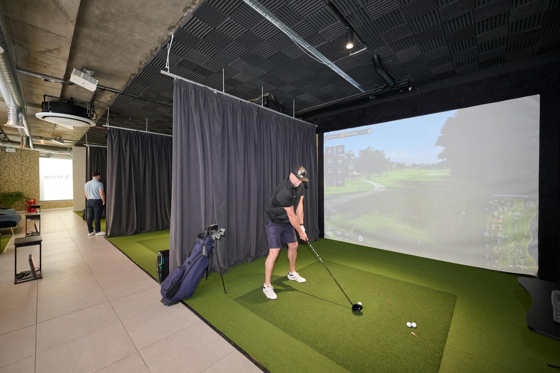 A player in a simulator bay at Caddi Club Chelsea