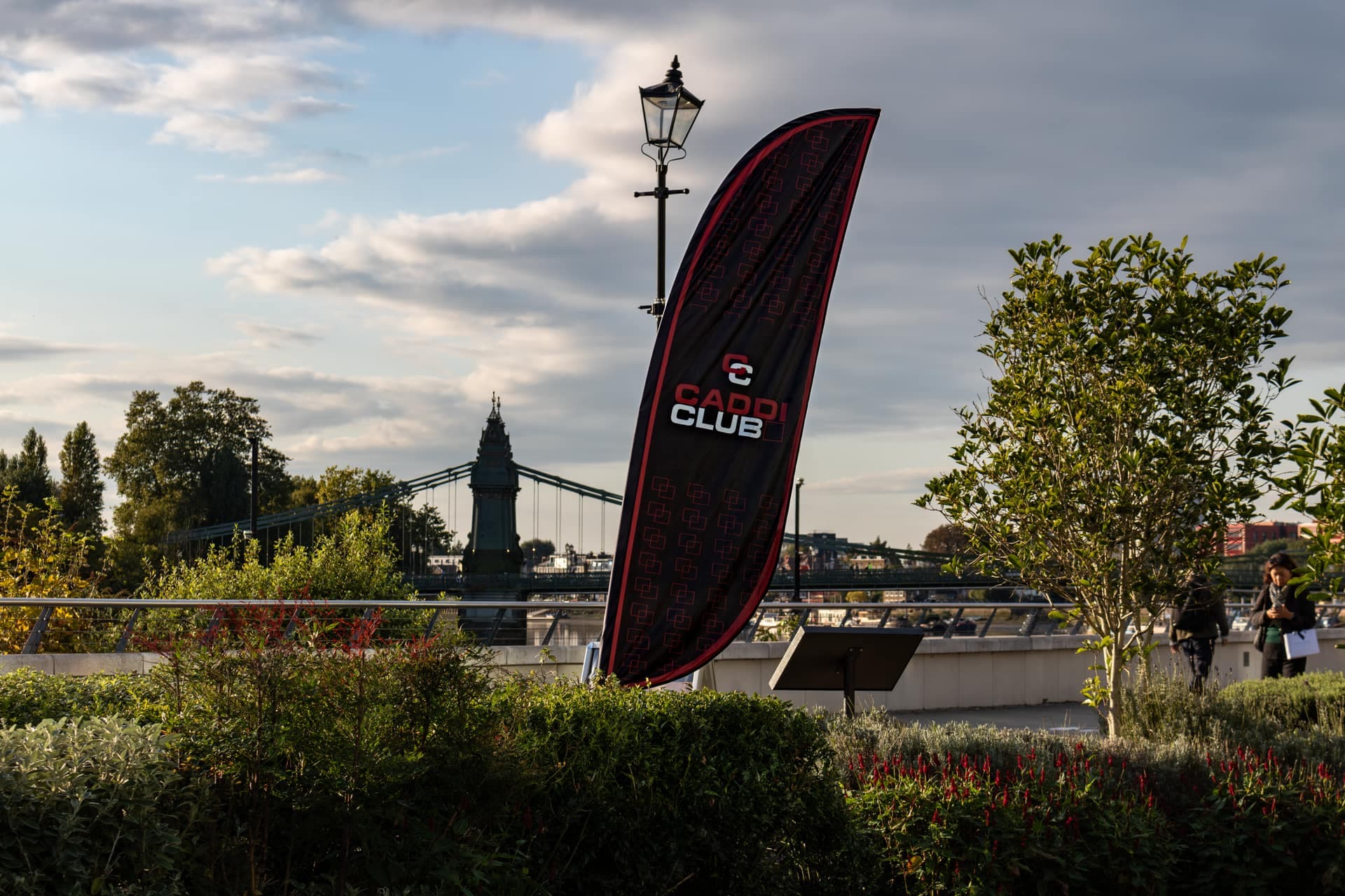 The Caddi Club flag on the Thames Path, Hammersmith Bridge behind