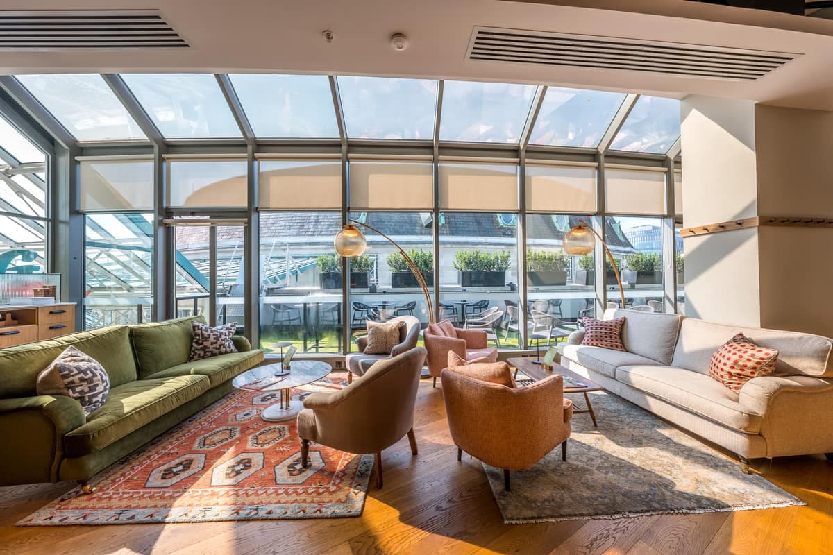 The glass-roofed lounge at Caddi Club Wimbledon